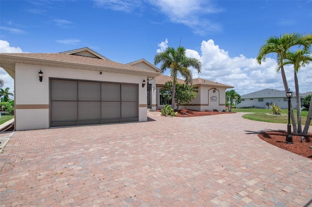 ranch-style house featuring a garage