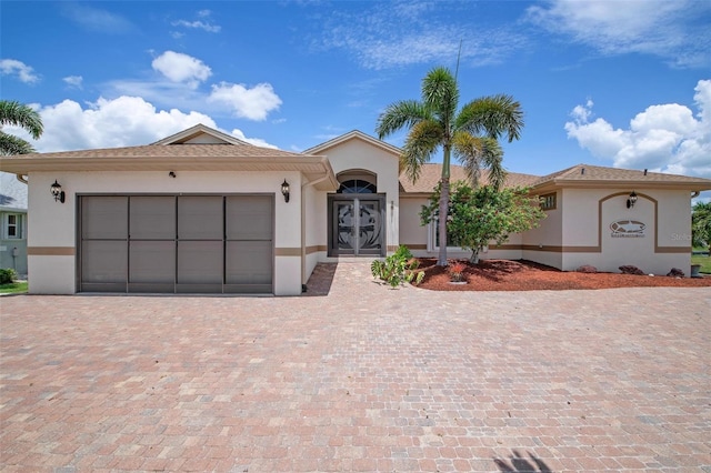 view of front of property with a garage