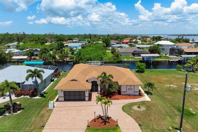 birds eye view of property with a water view