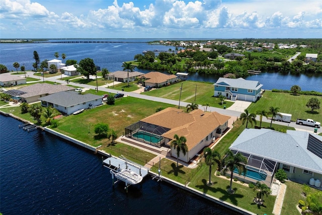 birds eye view of property featuring a water view