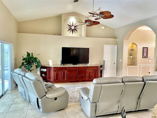 tiled living room featuring high vaulted ceiling and ceiling fan