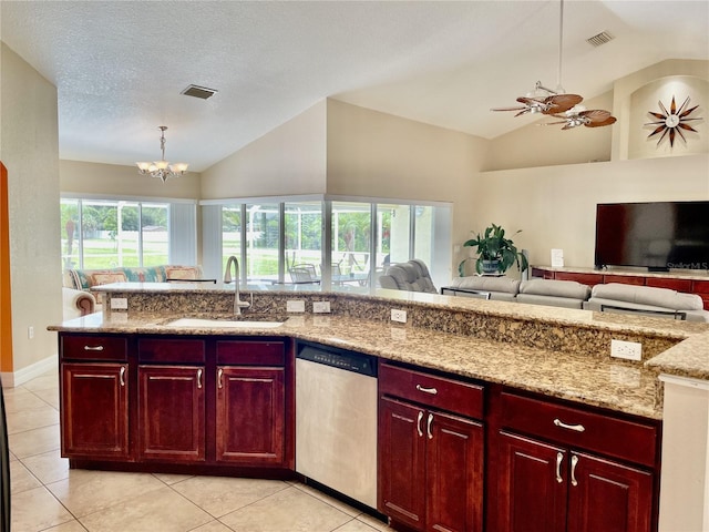 kitchen featuring stainless steel dishwasher, lofted ceiling, decorative light fixtures, and sink