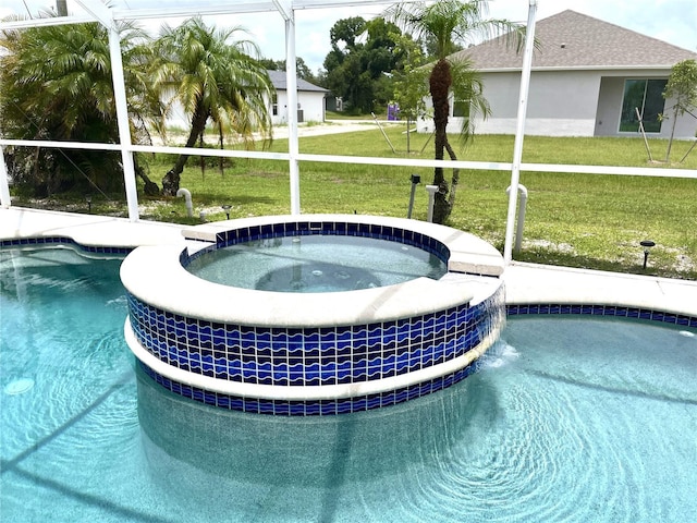 view of swimming pool with an in ground hot tub and a yard