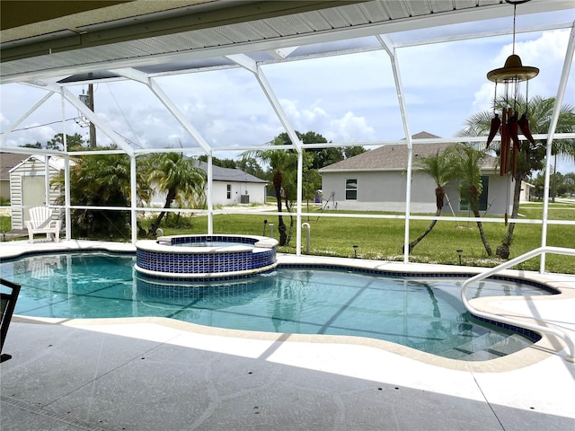 view of pool featuring an in ground hot tub, a lanai, and a patio area