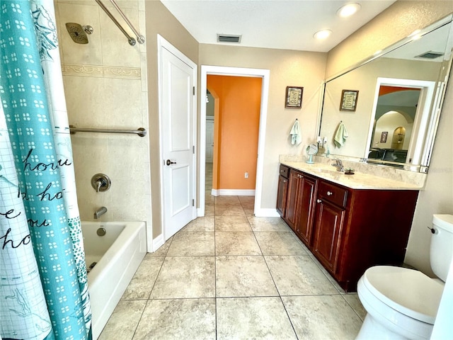 full bathroom featuring vanity, shower / bath combo, tile patterned floors, and toilet