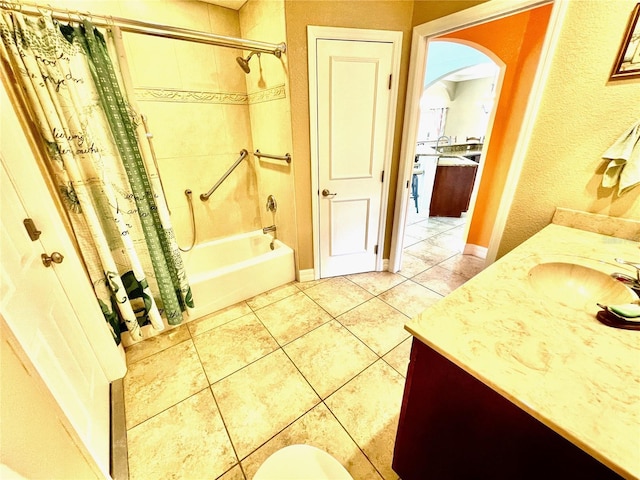 bathroom with vanity, tile patterned flooring, and shower / bath combo with shower curtain