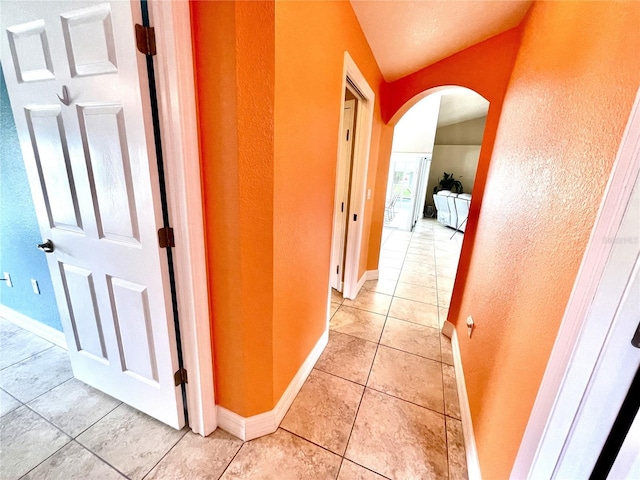 hallway with light tile patterned floors