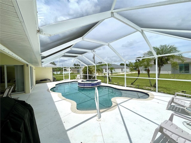 view of pool with a yard, a lanai, a patio area, and an in ground hot tub