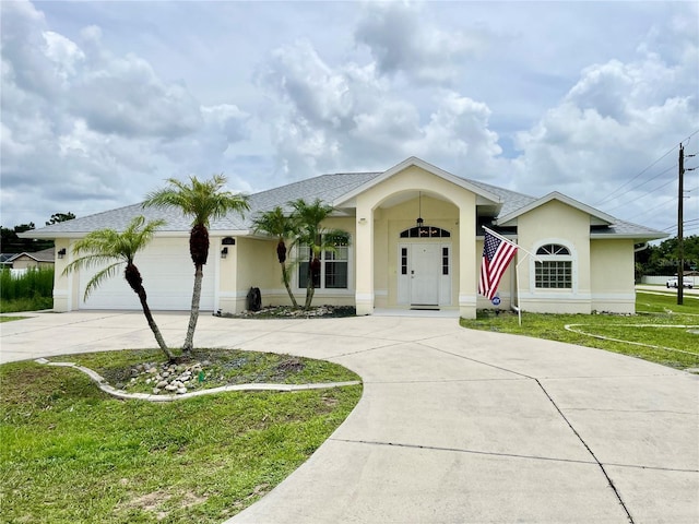 single story home with a garage and a front yard