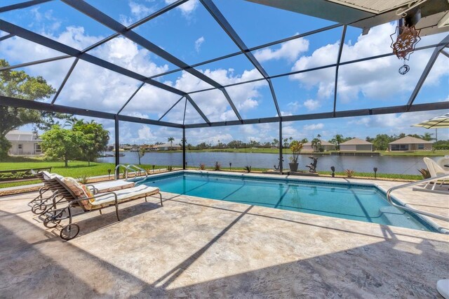 view of swimming pool featuring a patio area, a water view, and a lanai