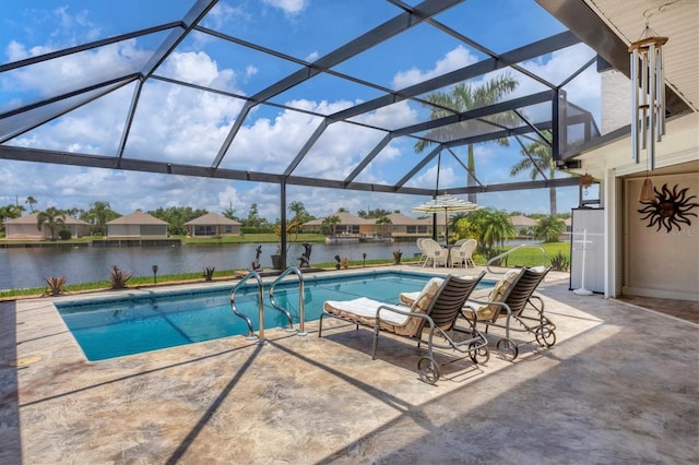 view of pool featuring a lanai, a water view, and a patio area