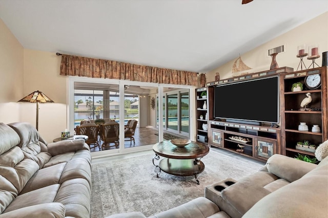 living room featuring vaulted ceiling and wood-type flooring