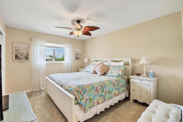 bedroom with ceiling fan and light wood-type flooring