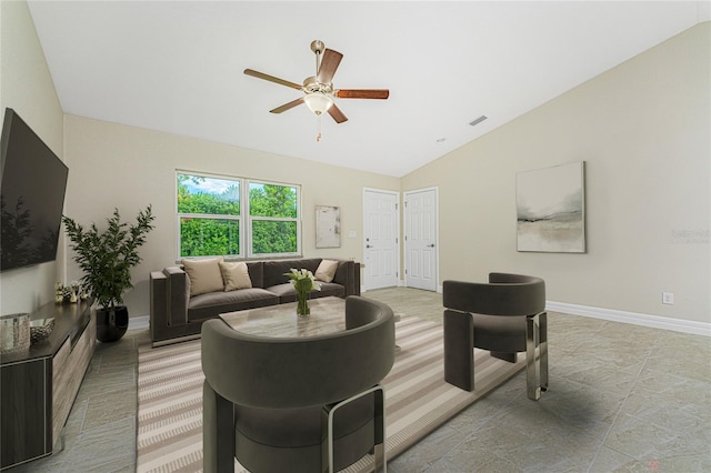 living room featuring tile patterned floors, ceiling fan, and vaulted ceiling