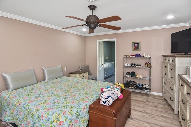 bedroom featuring connected bathroom, crown molding, light wood-type flooring, and ceiling fan