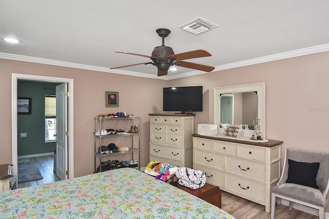 bedroom with ensuite bathroom, ornamental molding, ceiling fan, and light hardwood / wood-style floors