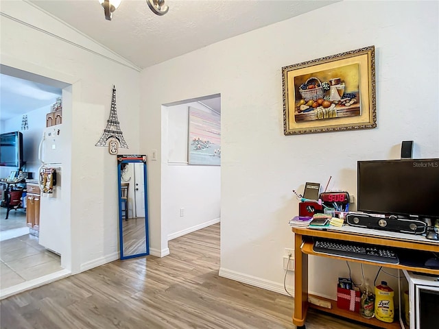 interior space featuring hardwood / wood-style flooring and a textured ceiling