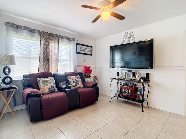 tiled living room with ceiling fan