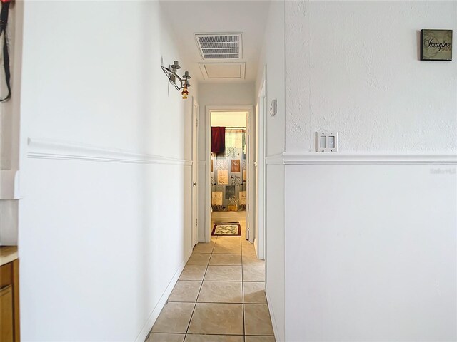 hallway with light tile patterned flooring