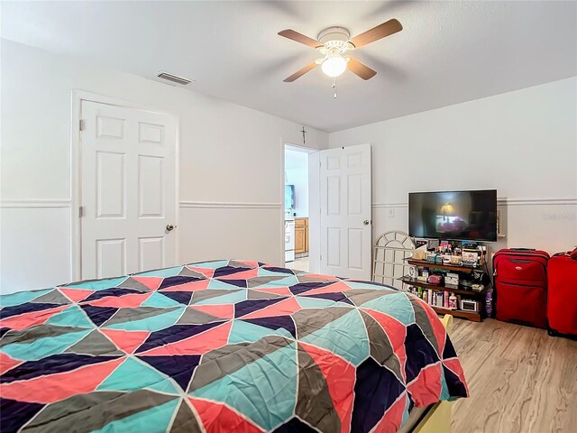 bedroom featuring light hardwood / wood-style floors and ceiling fan