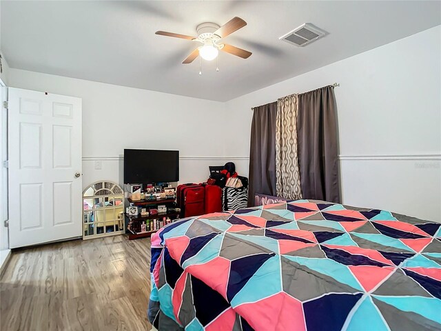 bedroom featuring light wood-type flooring and ceiling fan