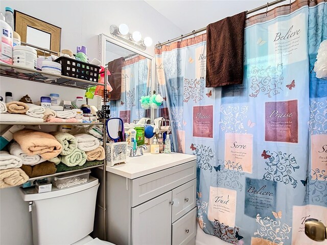 bathroom with vanity and toilet