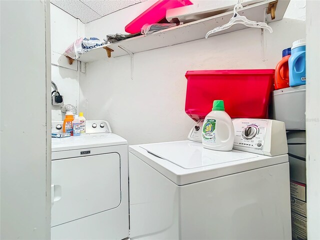 washroom with separate washer and dryer