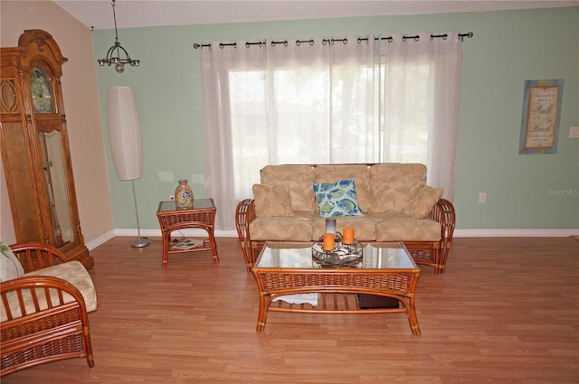 living room featuring wood-type flooring and plenty of natural light