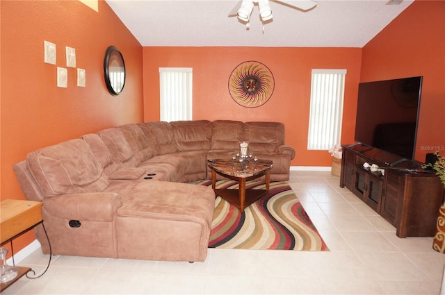 tiled living room with ceiling fan