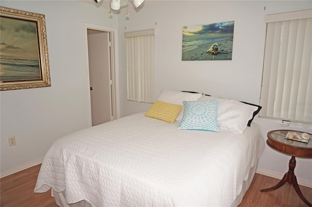 bedroom with hardwood / wood-style floors