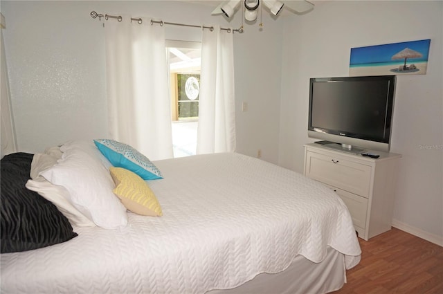 bedroom featuring ceiling fan and hardwood / wood-style floors