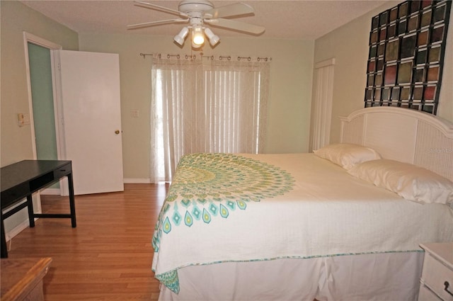 bedroom featuring ceiling fan and wood-type flooring