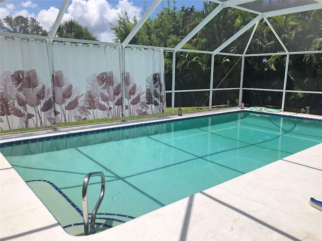 view of pool featuring a lanai