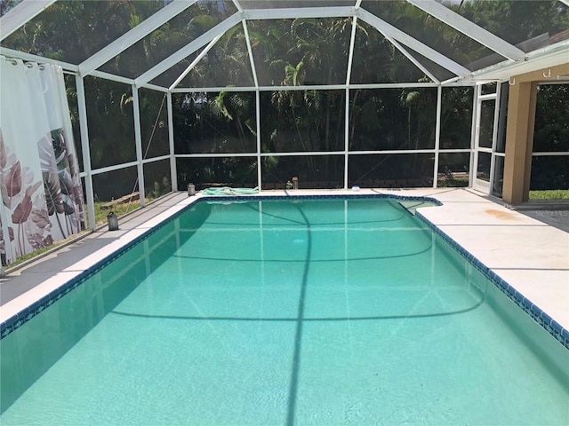 view of pool featuring a lanai