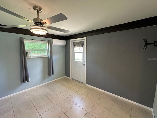 tiled empty room with a wall mounted air conditioner and ceiling fan