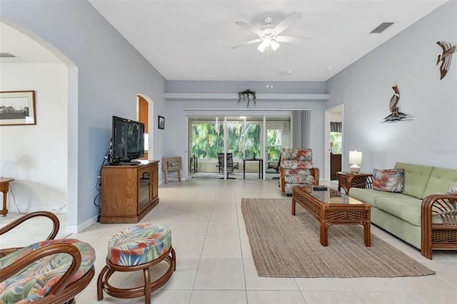 tiled living room featuring ceiling fan