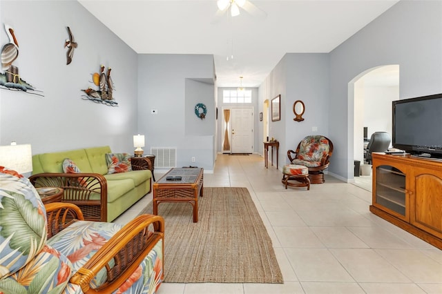 living room with light tile patterned floors and ceiling fan