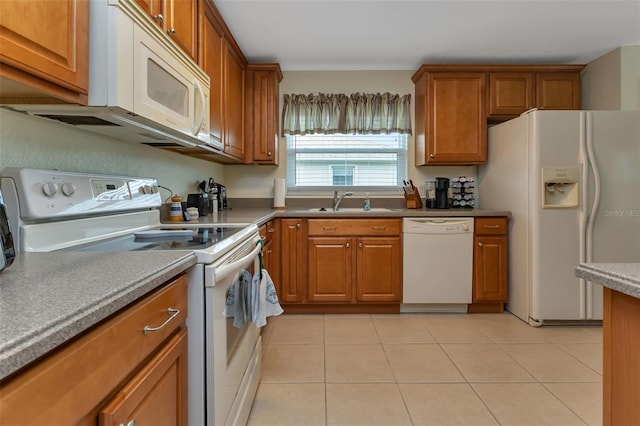 kitchen featuring sink, white appliances, and light tile patterned floors