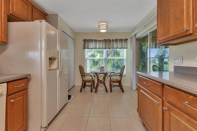 kitchen featuring white appliances and light tile patterned floors