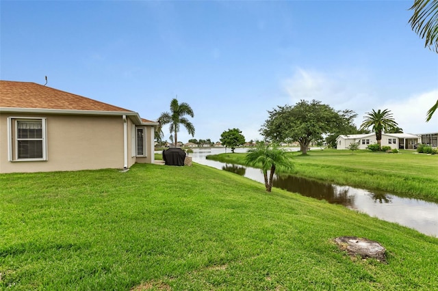 view of yard with a water view