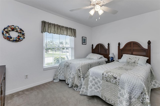 bedroom with light colored carpet and ceiling fan