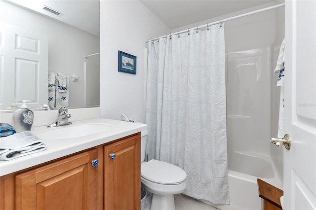 full bathroom featuring vanity, shower / bath combo, and toilet