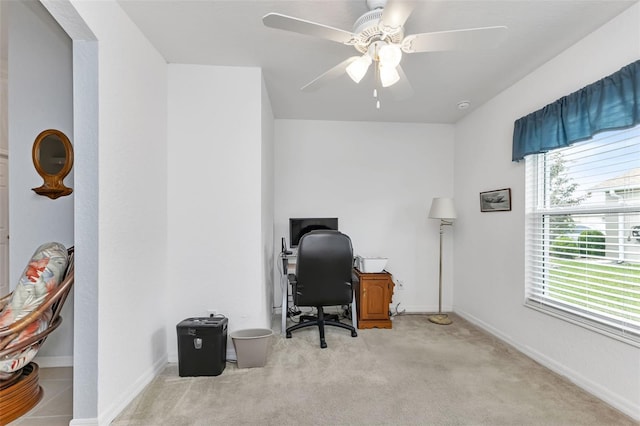 office area with ceiling fan and light carpet