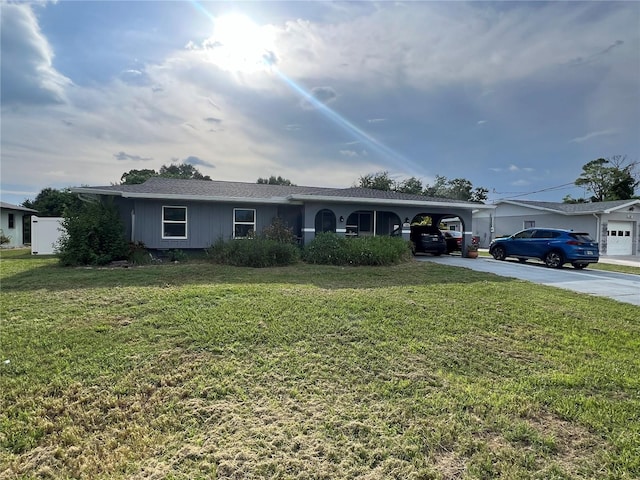 ranch-style home with a carport and a front lawn