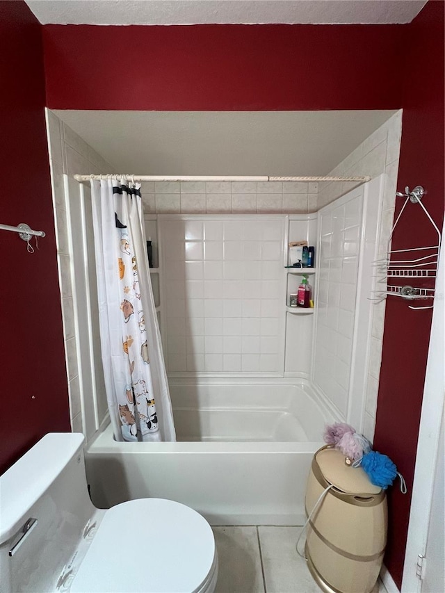 bathroom featuring tile patterned flooring, a textured ceiling, toilet, and shower / tub combo with curtain