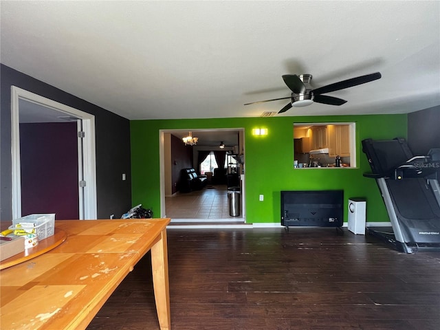 interior space with ceiling fan and wood-type flooring