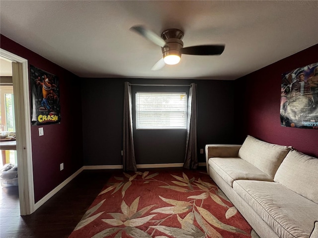 unfurnished living room with dark hardwood / wood-style flooring and ceiling fan