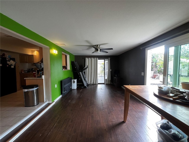 interior space with ceiling fan, hardwood / wood-style flooring, and a healthy amount of sunlight