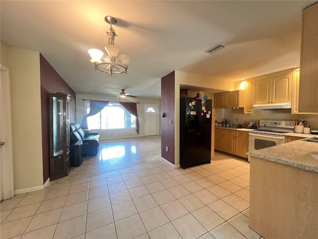 1405 Dorchester St, Port Charlotte, FL 33952 - kitchen featuring black fridge, electric range, under cabinet range hood, a chandelier, and open floor plan