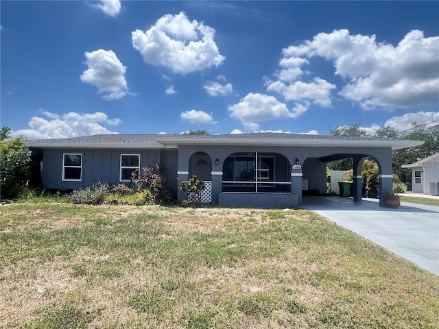 1405 Dorchester St, Port Charlotte, FL 33952 - single story home with a front lawn, driveway, and a carport